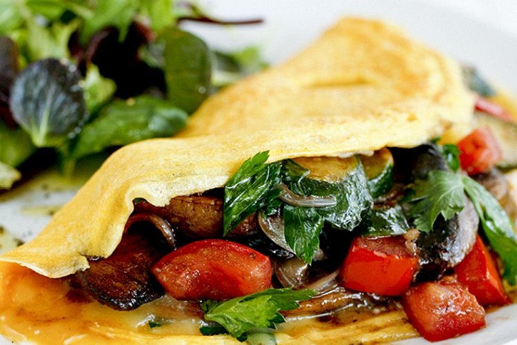 Omelet with tomatoes, zucchini and mushrooms
