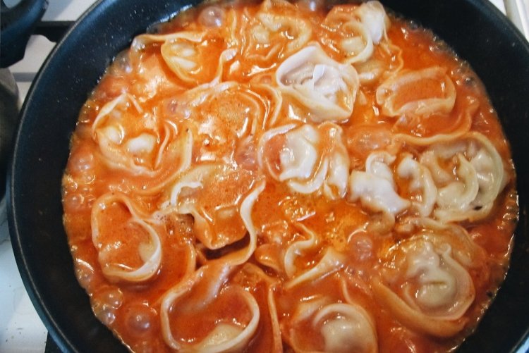 Fried dumplings in spicy sauce