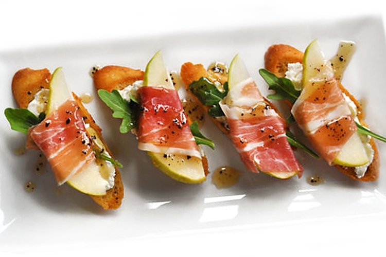 Canape with prosciutto and pear