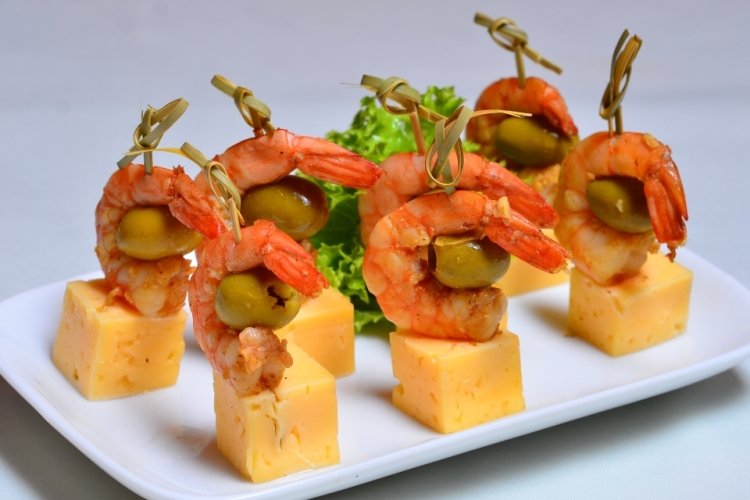 Tiger prawn canapes, olives and cheese