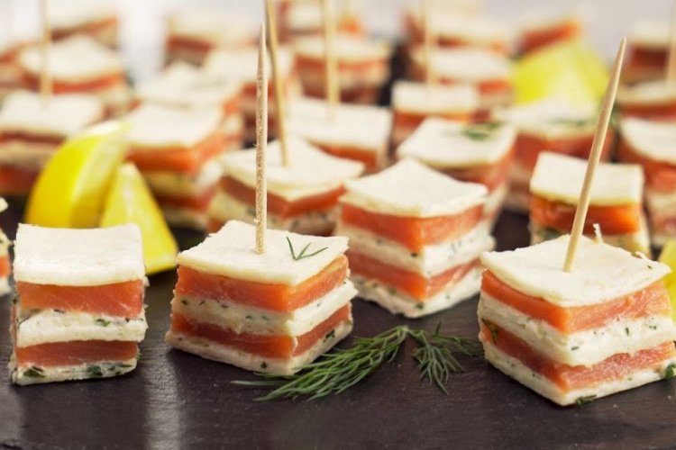 Multi-layered canapes with trout and curd cheese
