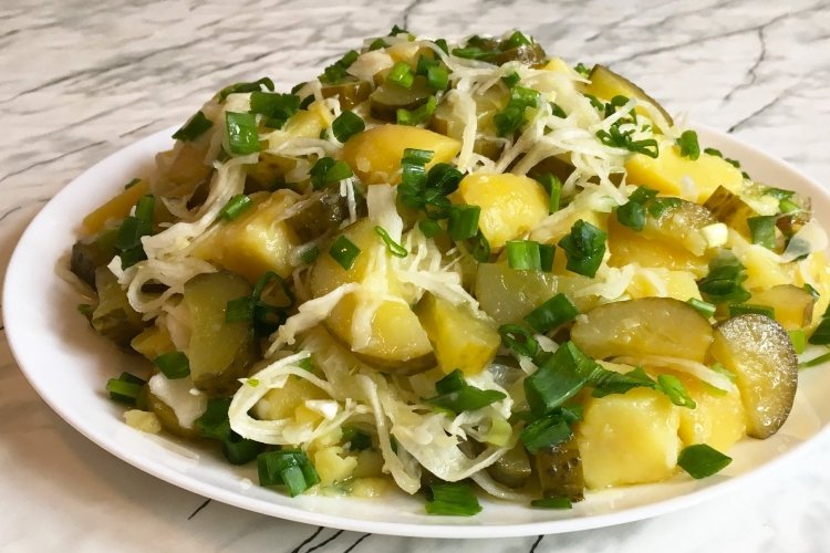 Sauerkraut, potato and pickled cucumber salad