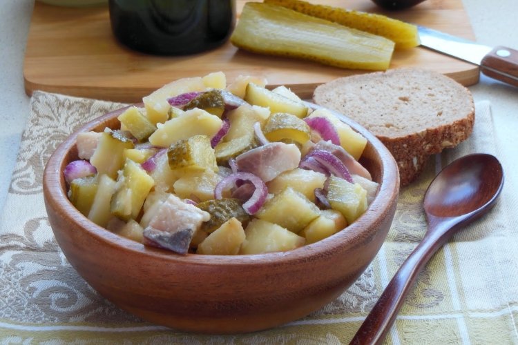 Homemade salad of pickles, herring and potatoes