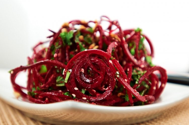 Raw beetroot salad with carrots and mung bean sprouts