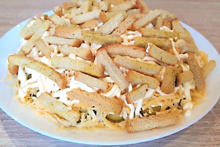 Potato salad with sprats and kirieshki