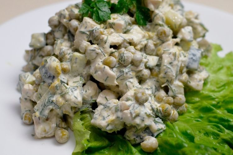 Salad with marinated champignons, pigtail cheese and green peas