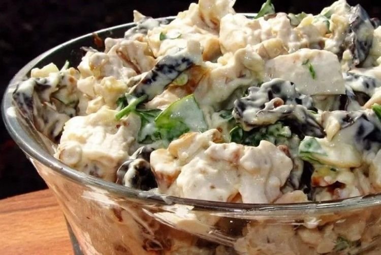Salad with prunes, chicken, pigtail cheese and eggs