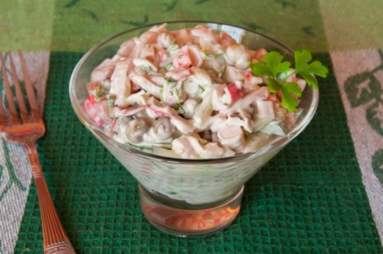Salad with crab meat, pickled mushrooms, eggs and onions