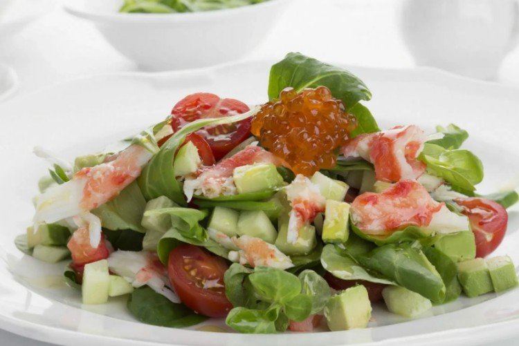 Fresh salad of avocado, crab meat and vegetables