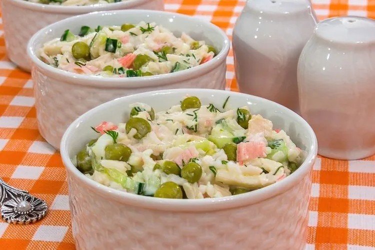 Salad with crab meat, eggs, pickles and green peas