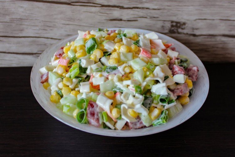 Salad with sausage, crab meat, corn and cucumbers