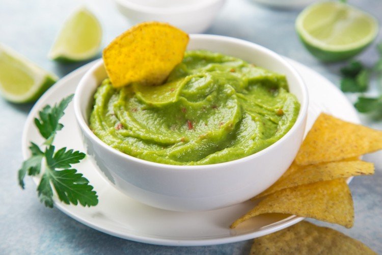 Guacamole with tomatoes and chili peppers