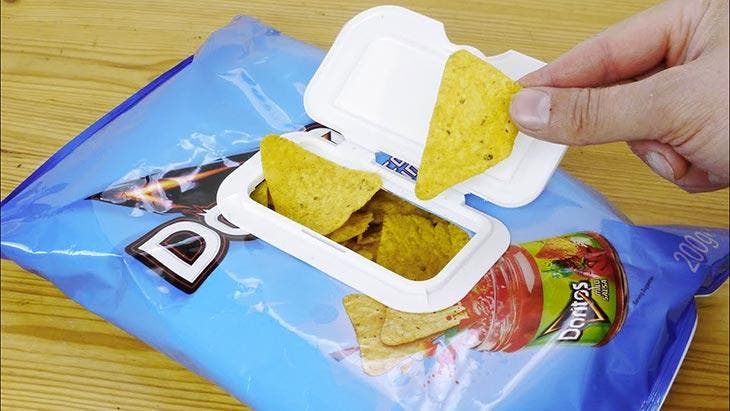 Close a pack of chips with a lid from a pack of napkins